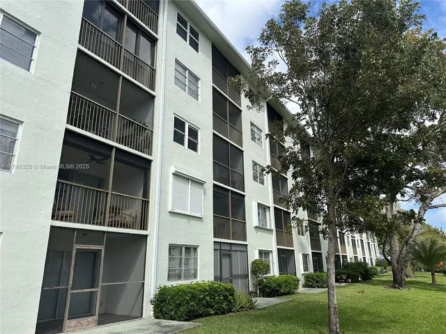 a view of a building with a yard
