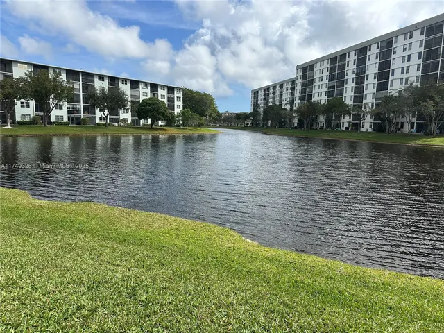 a view of swimming pool next to a lake view