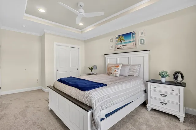 a bedroom with a bed and a dresser