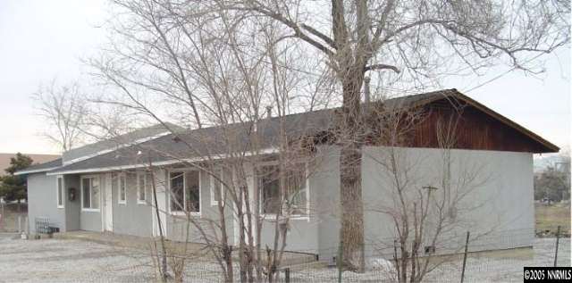760-790 Montello Street, Unit 5 Reno, NV 89512 - Photo 2 of 8 a view of a wooden house with a large tree