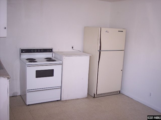 760-790 Montello Street, Unit 5 Reno, NV 89512 - Photo 7 of 8 a white refrigerator freezer and a stove sitting inside of a kitchen