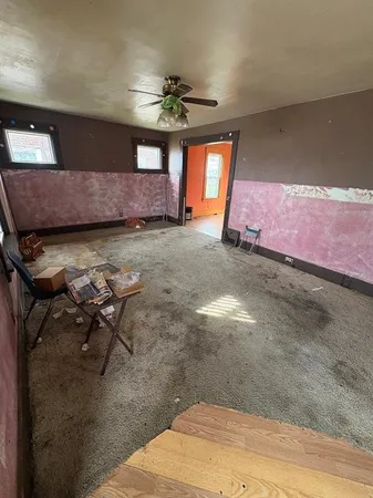 a living room with hard wood floors