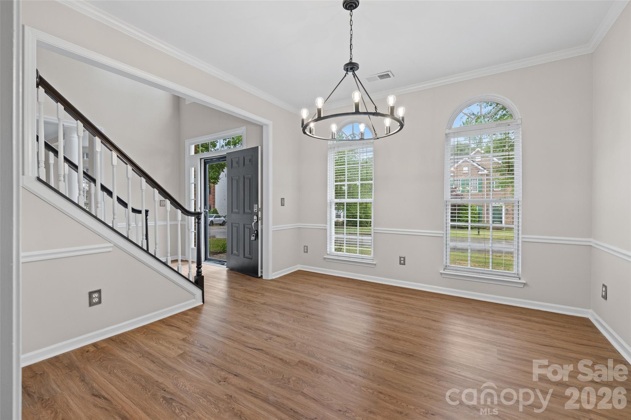 620 East Cheval Drive Fort Mill, SC 29708 - Photo 9 of 48 a view of an empty room with wooden floor fridge and a window