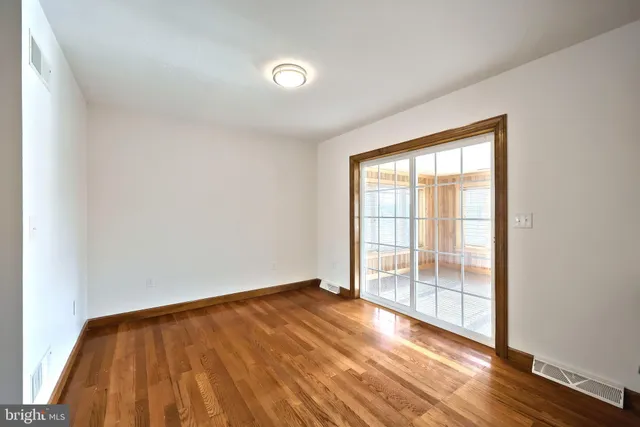 a view of a livingroom with a ceiling fan and window