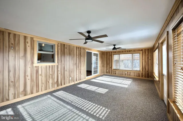 a bathroom with a double vanity sink a toilet and a mirror