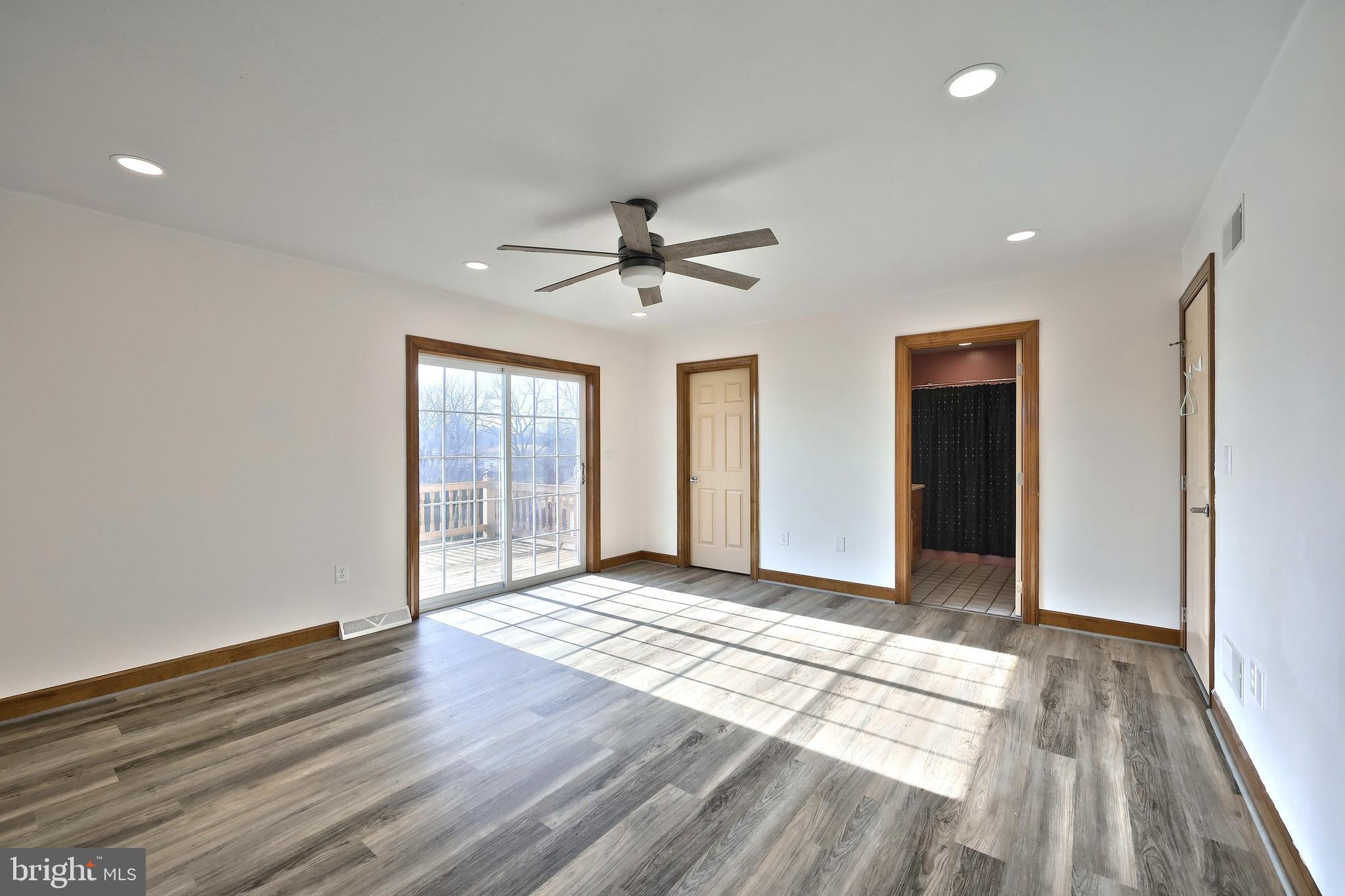 90 Vida Lane Dover, PA 17315 - Photo 19 of 59 a view of a livingroom with a ceiling fan and window