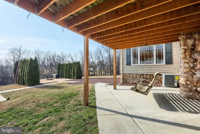 a view of a house with yard and a garden