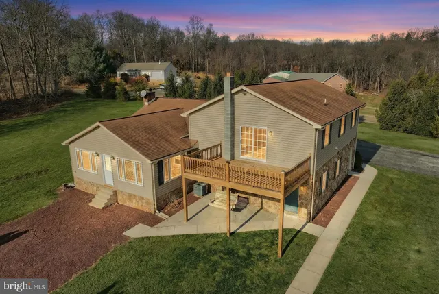 a big yard with lots of green space and trees
