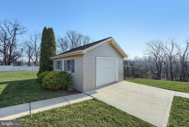 a black and white photo of a bench in a building