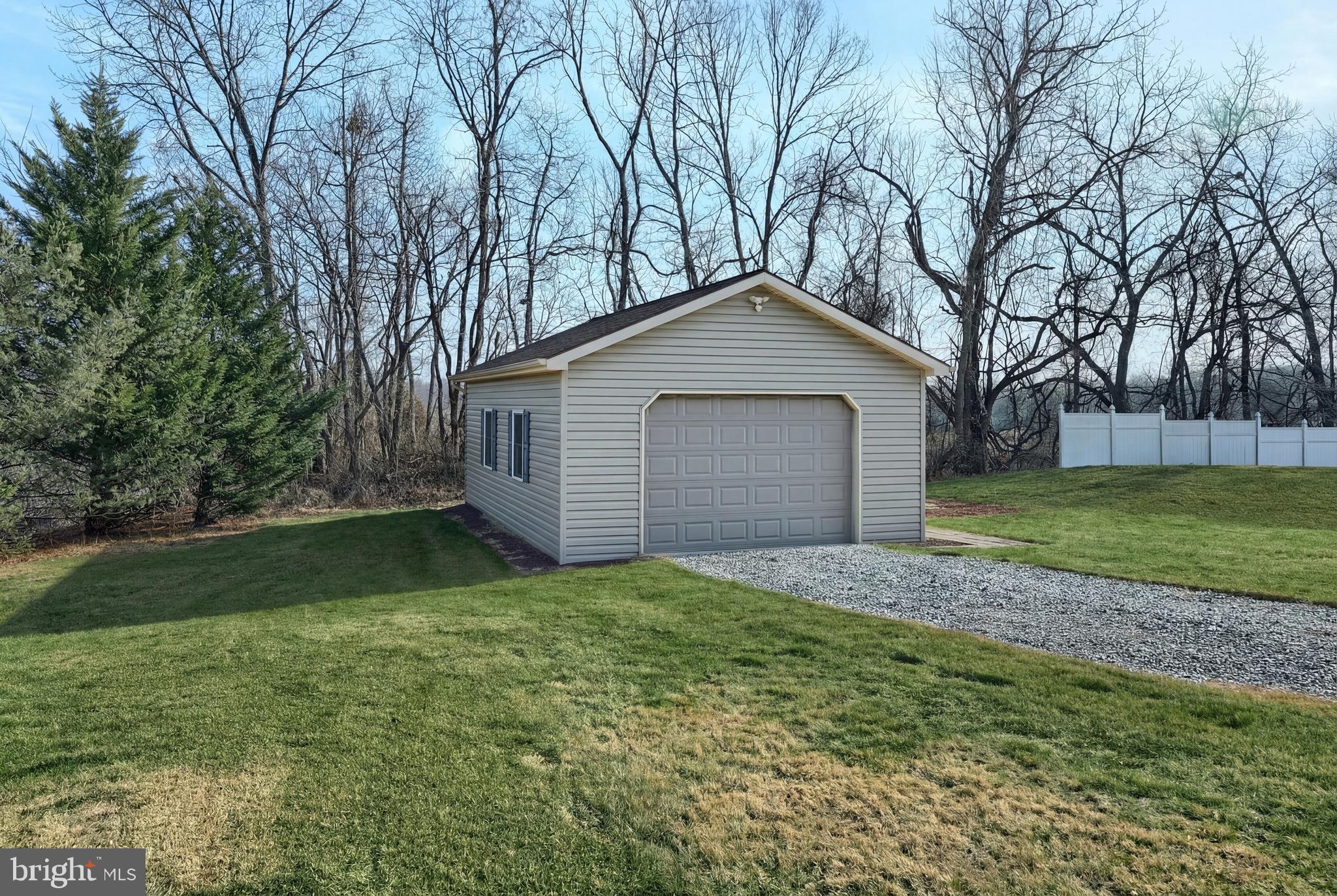 90 Vida Lane Dover, PA 17315 - Photo 41 of 59 a front view of a house with a yard and garage