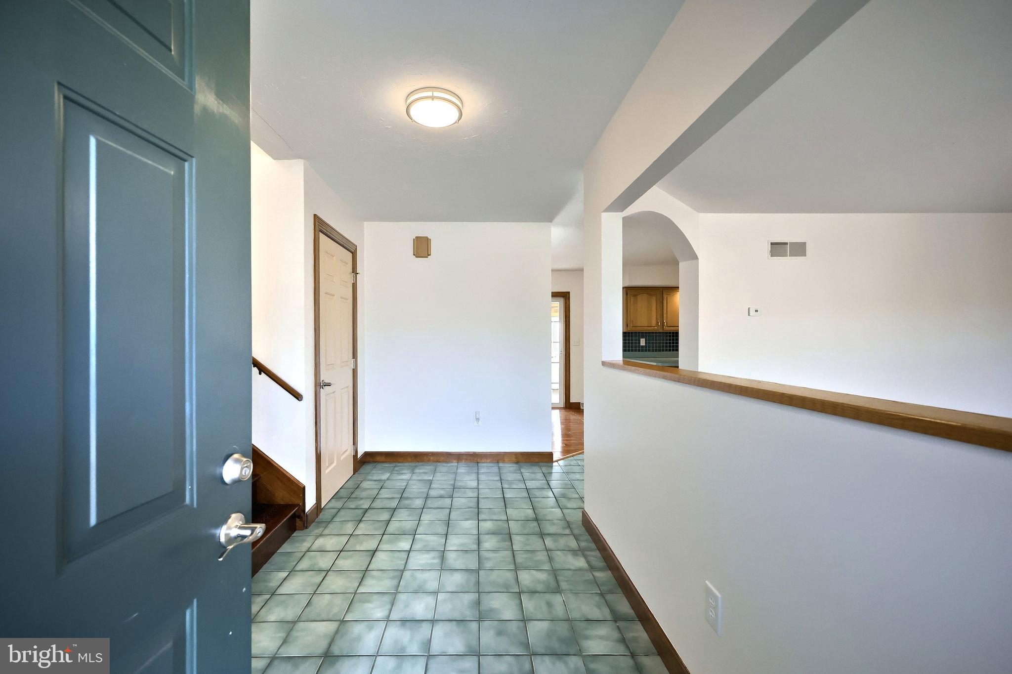 90 Vida Lane Dover, PA 17315 - Photo 5 of 59 a view of a hallway with wooden floor and staircase