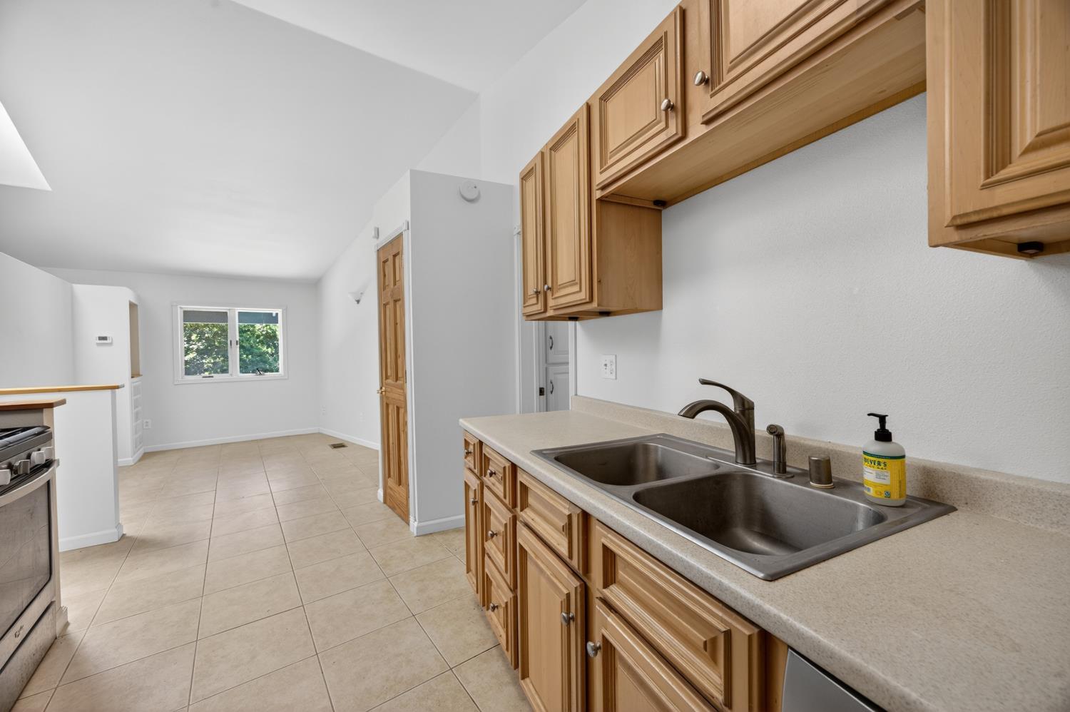 3940 Bannister Road Fair Oaks, CA 95628 - Photo 57 of 84 a kitchen with a sink and a refrigerator