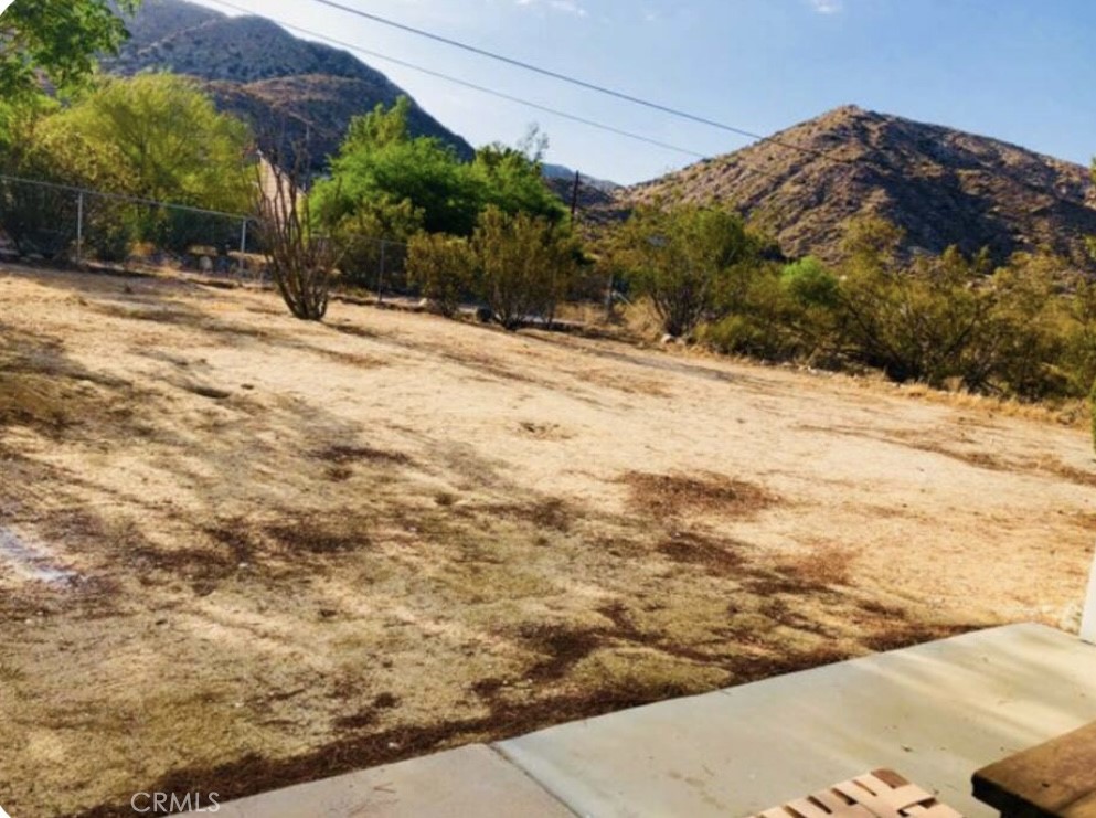 8960 South Samel Road Morongo Valley, CA 92256 - Photo 11 of 13 a view of a backyard of the house
