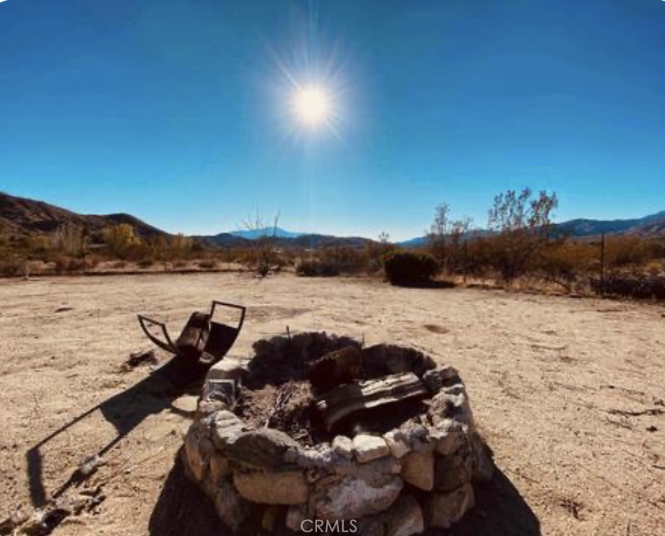 8960 South Samel Road Morongo Valley, CA 92256 - Photo 13 of 13 a view of a lake with a mountain
