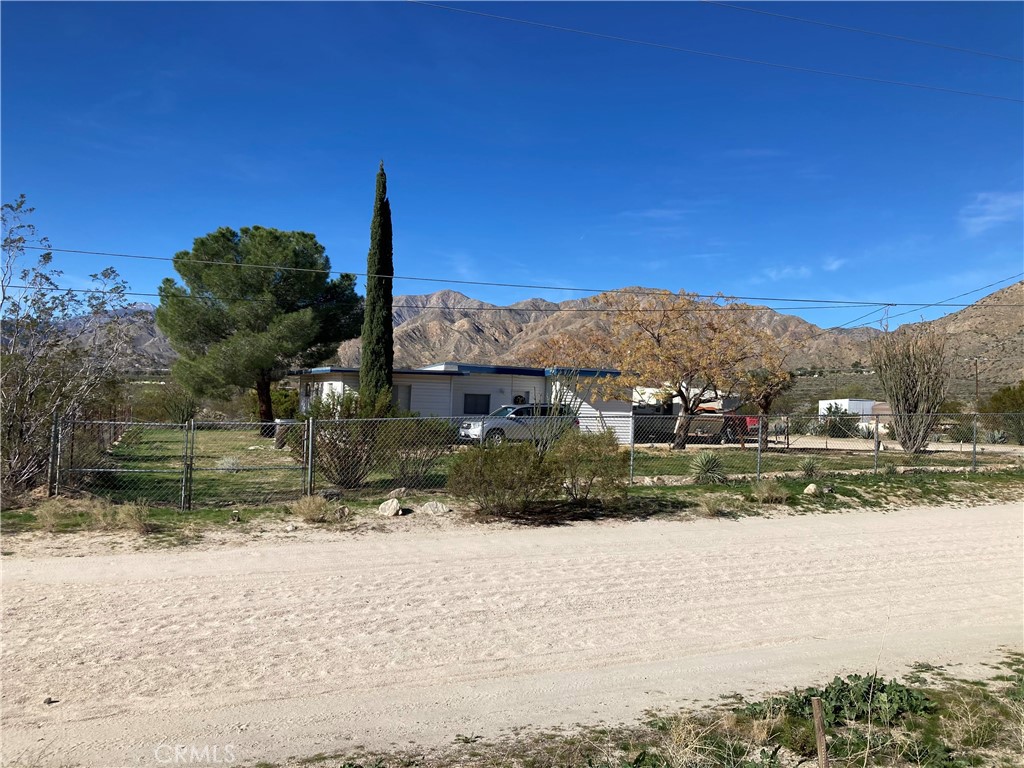8960 South Samel Road Morongo Valley, CA 92256 - Photo 2 of 13 a view of a house with a yard