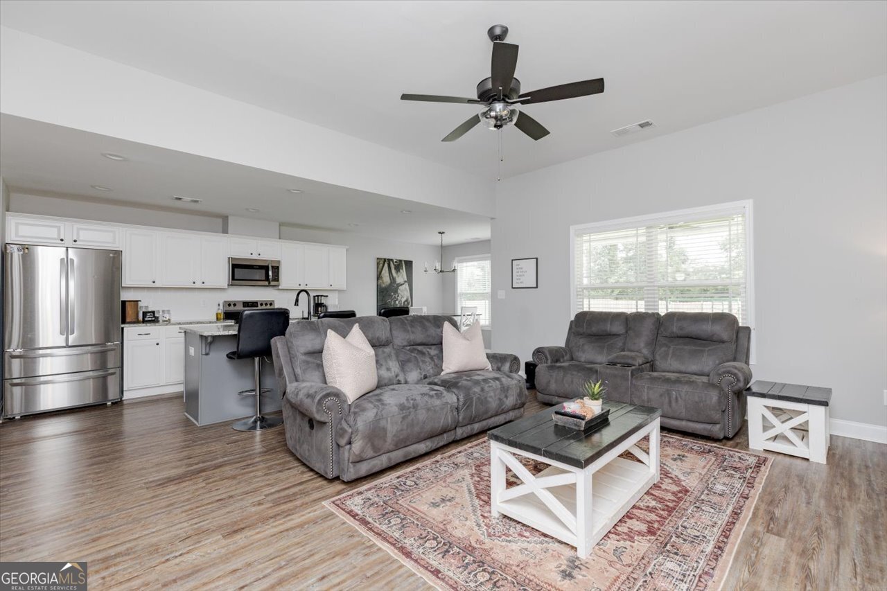 104 Meredith Layne Court Perry, GA 31069 - Photo 12 of 46 a living room with furniture and a view of kitchen