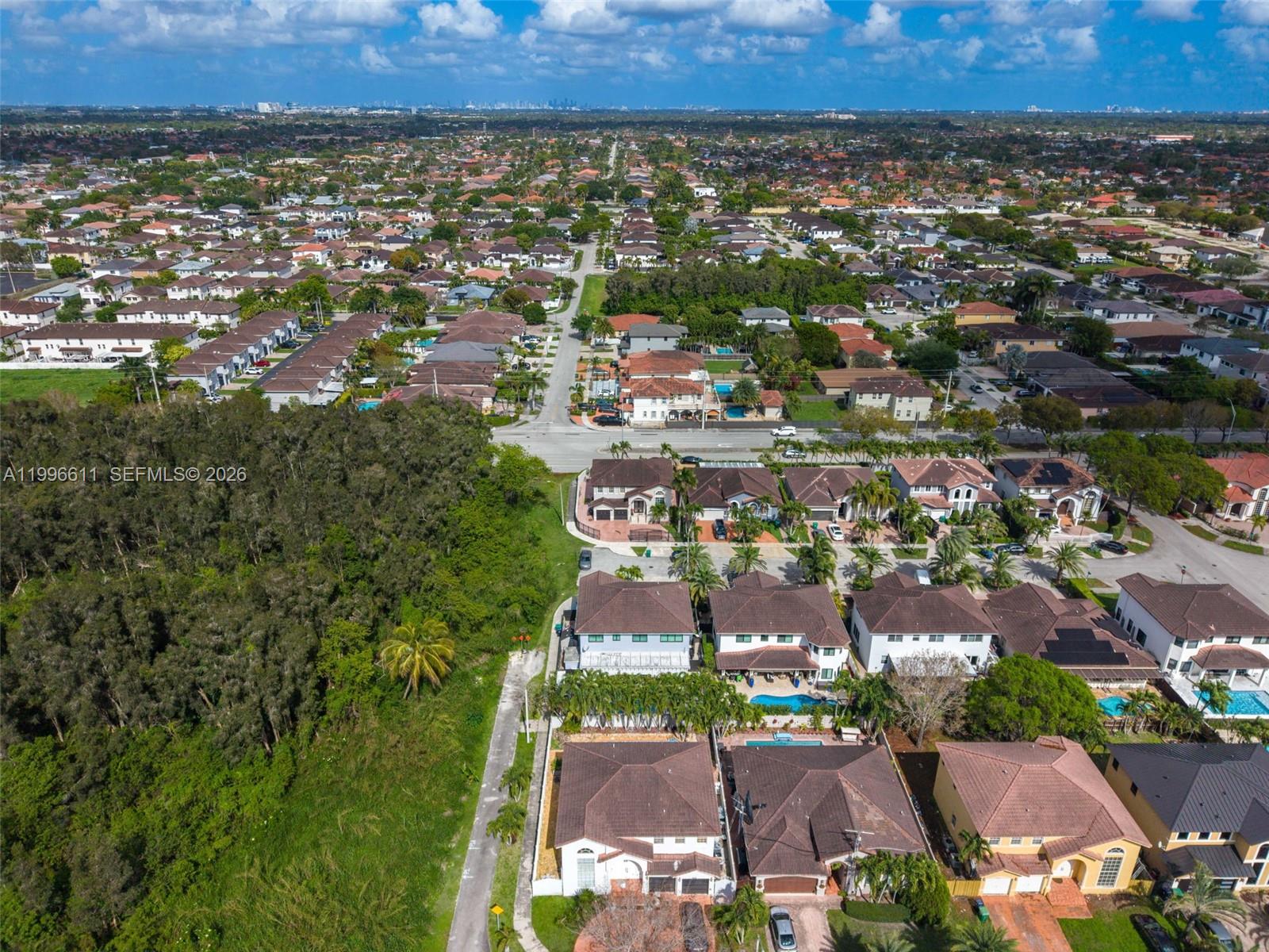 3002 Southwest 147th Court Miami, FL 33185 - Photo 13 of 97 an aerial view of residential houses with outdoor space