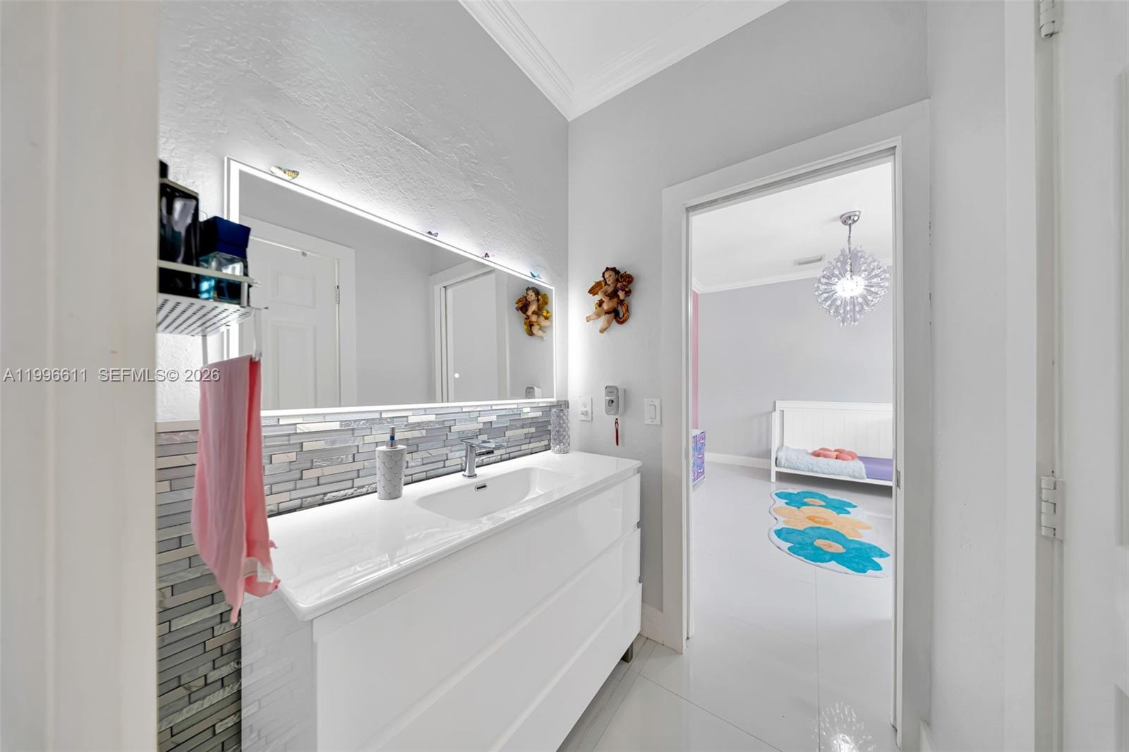 3002 Southwest 147th Court Miami, FL 33185 - Photo 23 of 97 a bathroom with a sink mirror and vanity