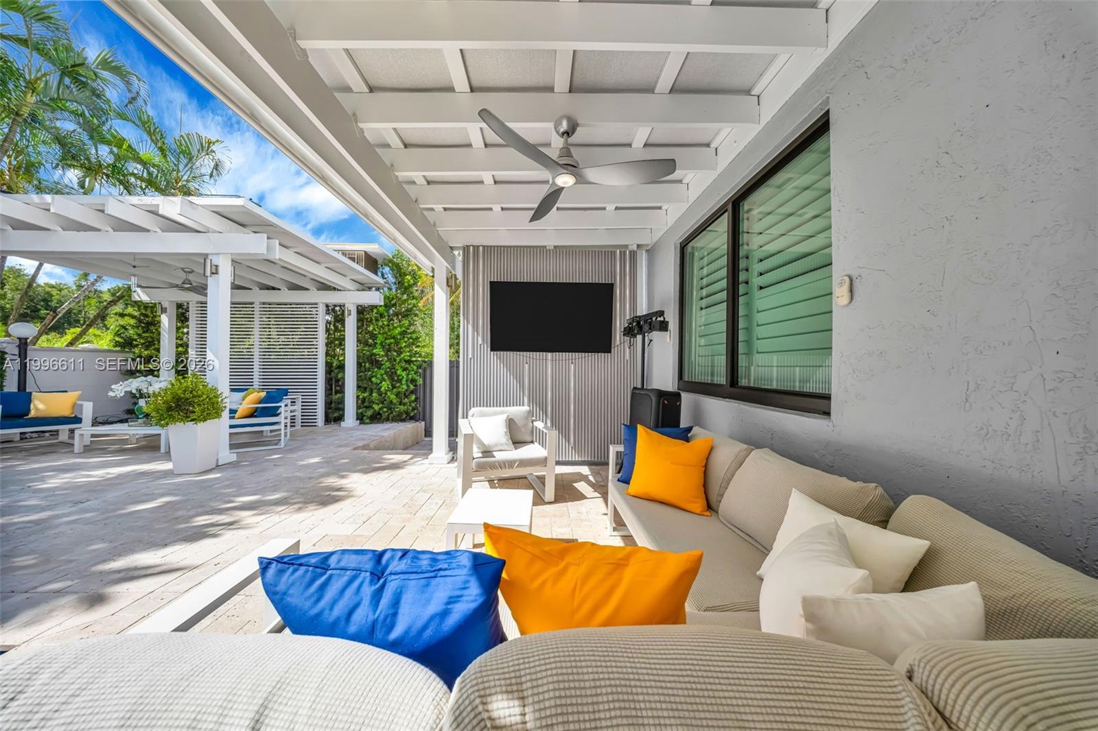3002 Southwest 147th Court Miami, FL 33185 - Photo 40 of 97 a outdoor space with patio the couches and a dining table with the potted plants