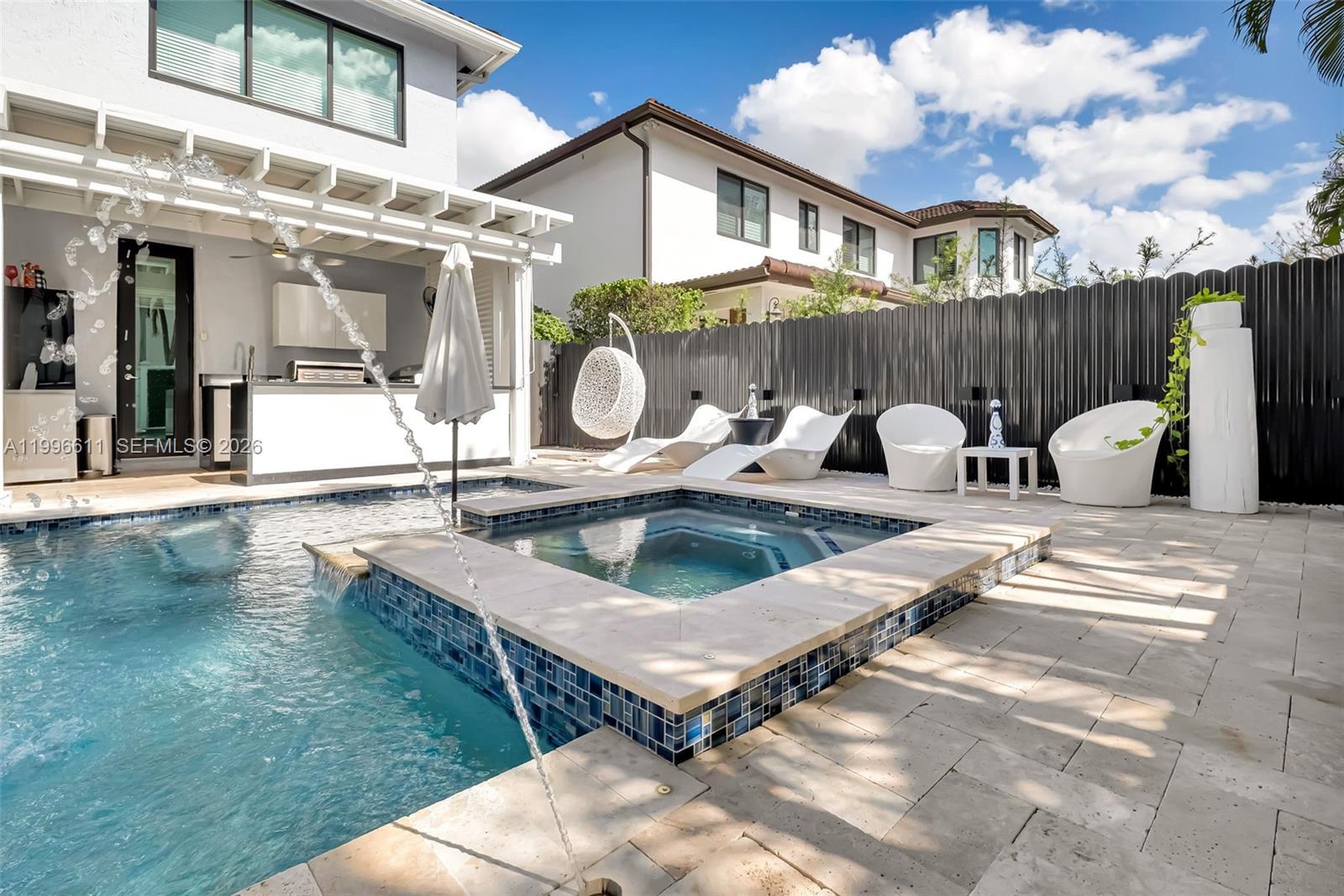 3002 Southwest 147th Court Miami, FL 33185 - Photo 44 of 97 a view of a house with swimming pool and sitting area
