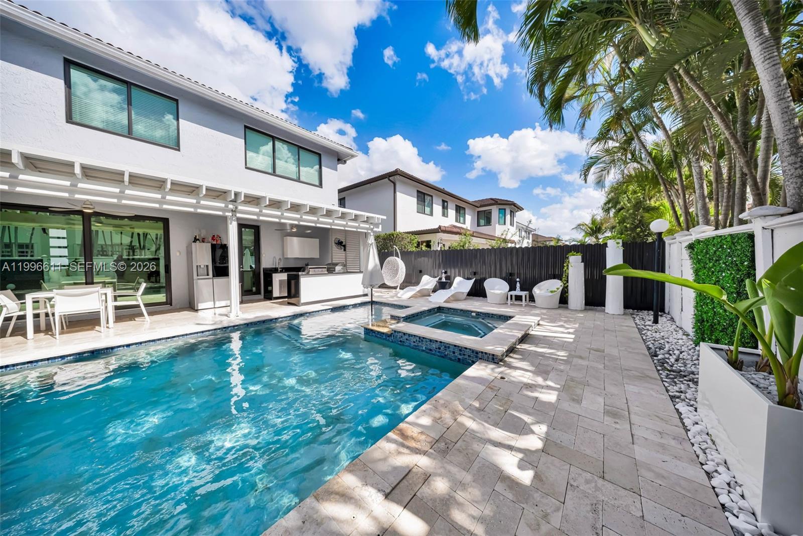 3002 Southwest 147th Court Miami, FL 33185 - Photo 45 of 97 a view of a house with a yard patio and swimming pool