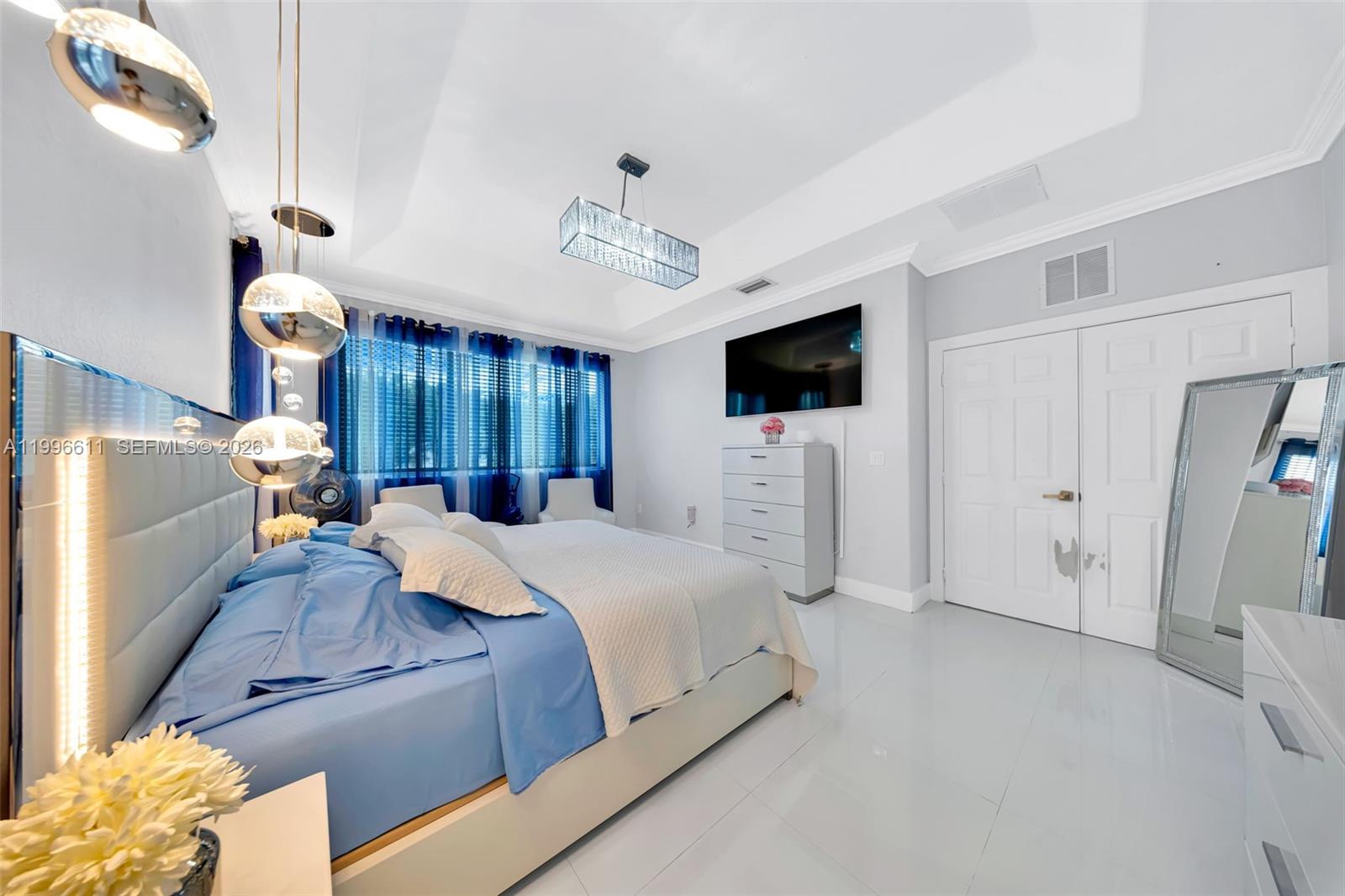 3002 Southwest 147th Court Miami, FL 33185 - Photo 54 of 97 a spacious bedroom with a bed and a view of bathroom