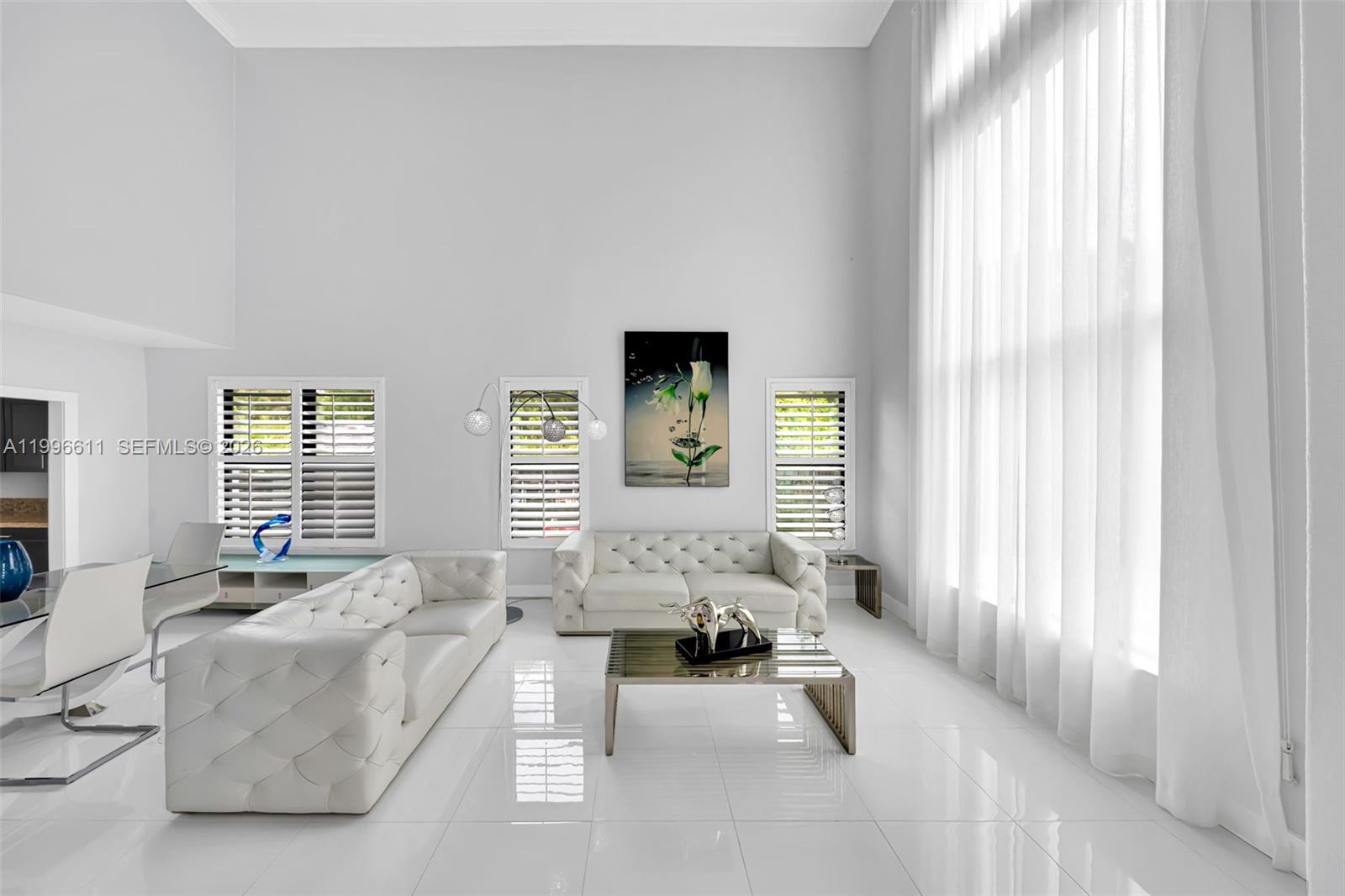 3002 Southwest 147th Court Miami, FL 33185 - Photo 79 of 97 a living room with furniture and a large window