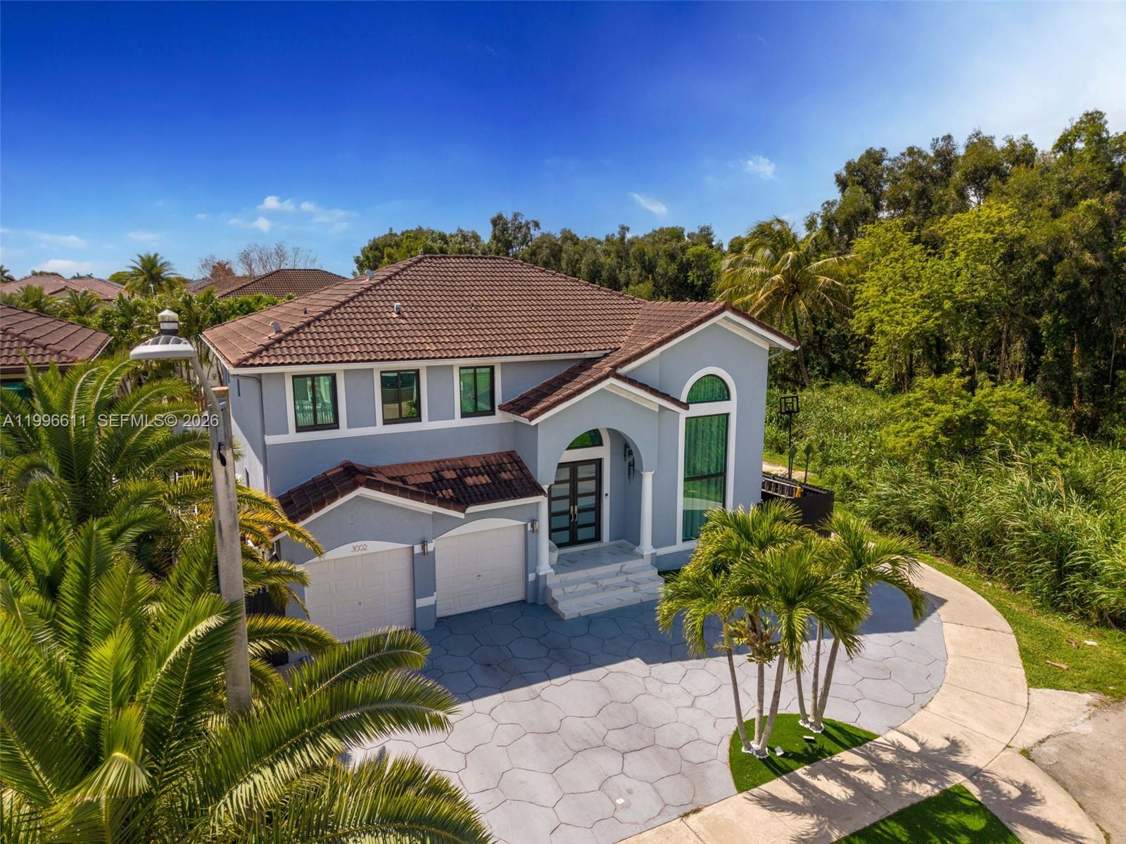 3002 Southwest 147th Court Miami, FL 33185 - Photo 85 of 97 a front view of a house with a yard