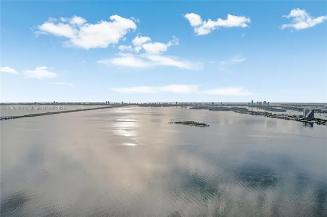 a room with furniture and a large window