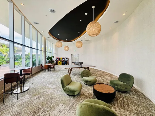 a view of swimming pool from outdoor seating