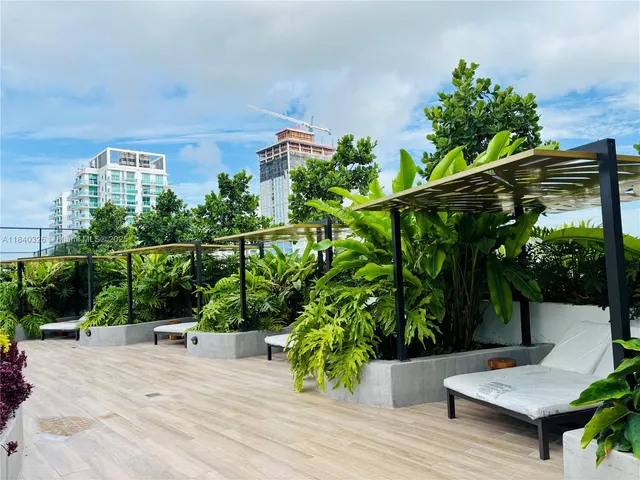swimming pool view with a seating space