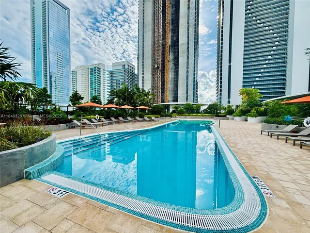 a view of an outdoor space and basketball court