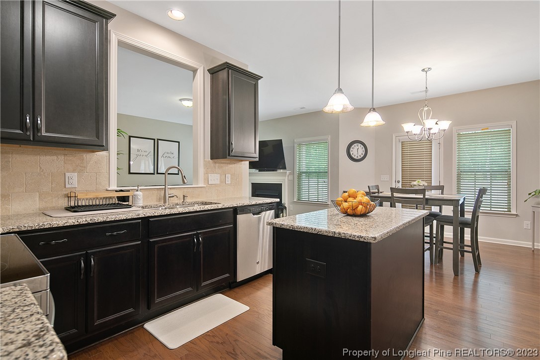 233 Blue Bay Lane Cameron, NC 28326 - Photo 22 of 50 a kitchen with a sink a counter space appliances and cabinets
