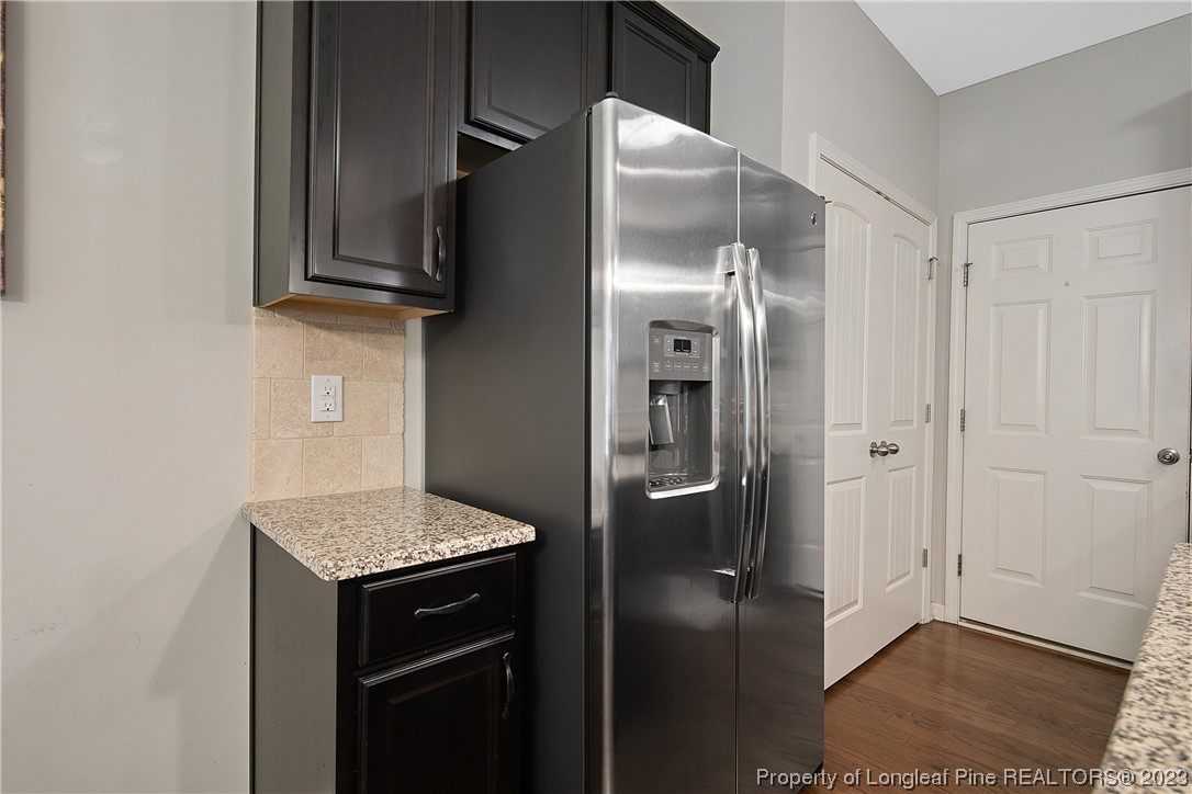 233 Blue Bay Lane Cameron, NC 28326 - Photo 23 of 50 a kitchen with stainless steel appliances granite countertop a refrigerator and a sink