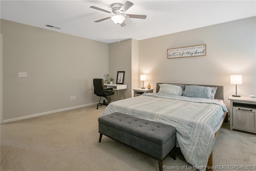 233 Blue Bay Lane Cameron, NC 28326 - Photo 27 of 50 a bedroom with a bed and chair