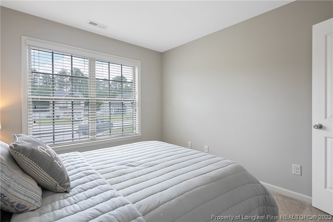 233 Blue Bay Lane Cameron, NC 28326 - Photo 37 of 50 a bedroom with a bed and a window