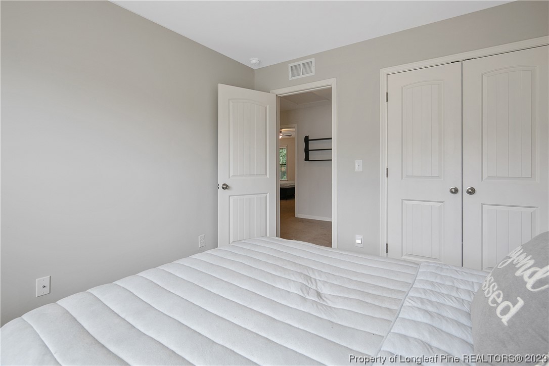 233 Blue Bay Lane Cameron, NC 28326 - Photo 39 of 50 a bedroom with a bed and a bathroom