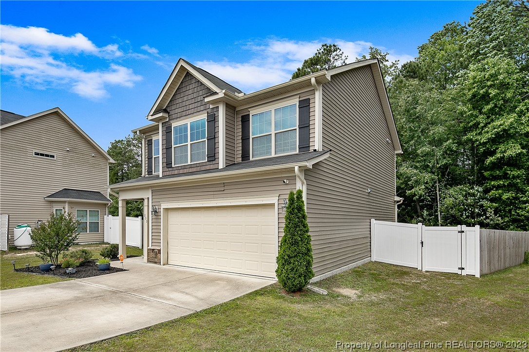 233 Blue Bay Lane Cameron, NC 28326 - Photo 4 of 50 a view of a house with a yard and potted plants