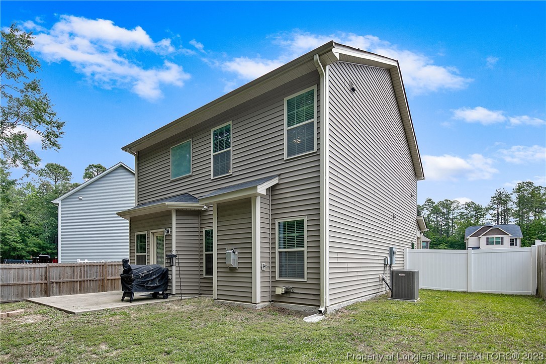 233 Blue Bay Lane Cameron, NC 28326 - Photo 49 of 50 a front view of a house with a yard