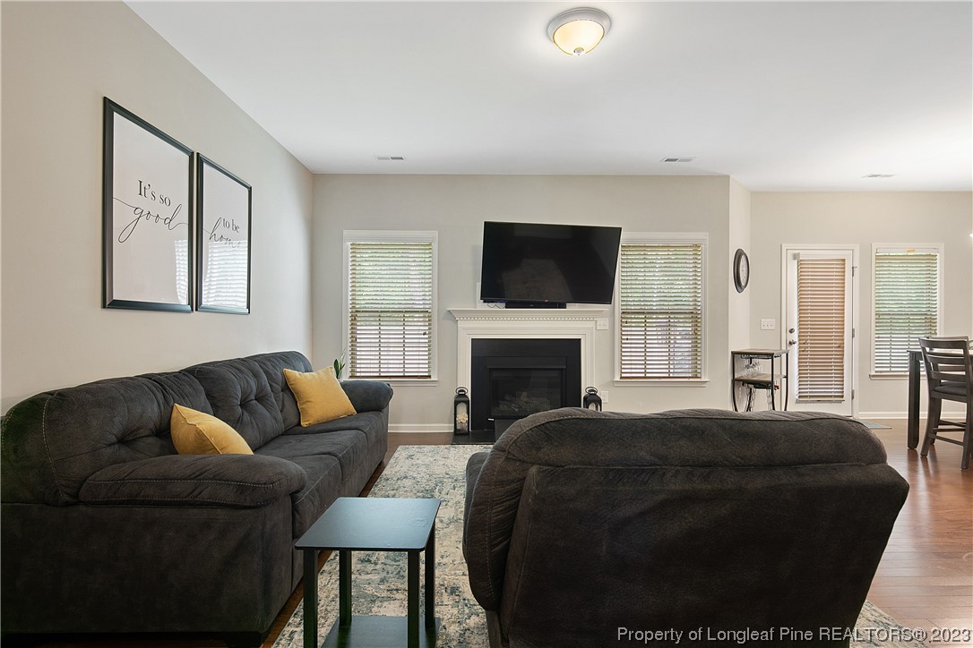 233 Blue Bay Lane Cameron, NC 28326 - Photo 9 of 50 a living room with fireplace furniture and a flat screen tv