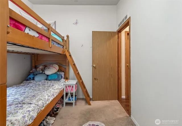 a view of kitchen with windows and refrigerator