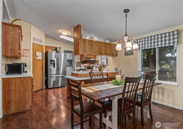 a view of a dining room with furniture window and wooden floor