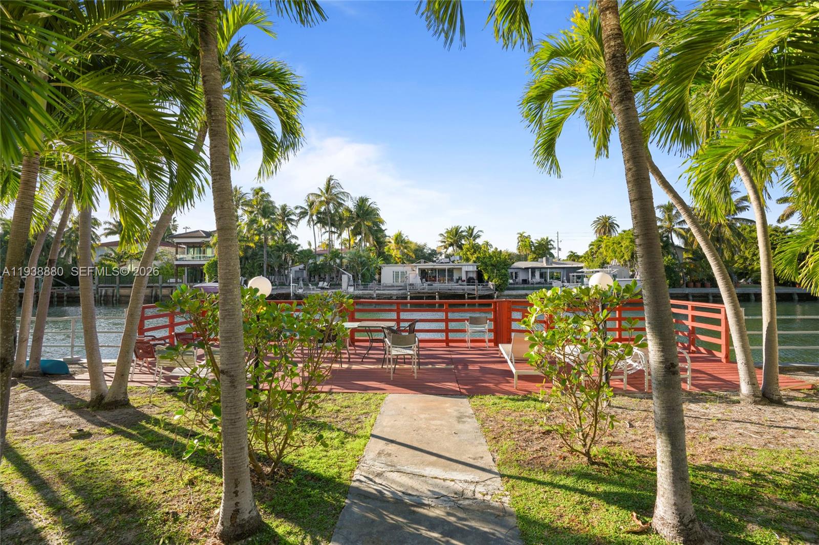 4172 Chase Avenue, Unit 3 Miami Beach, FL 33140 - Photo 22 of 29 a view of a yard with plants and palm trees