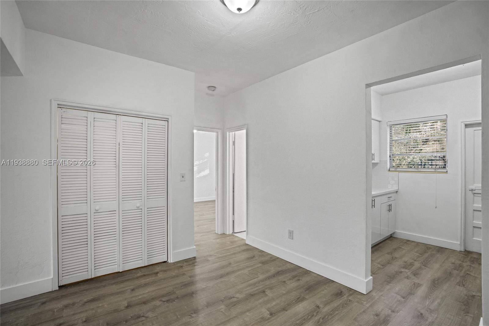 4172 Chase Avenue, Unit 3 Miami Beach, FL 33140 - Photo 8 of 29 an empty room with wooden floor & closet area