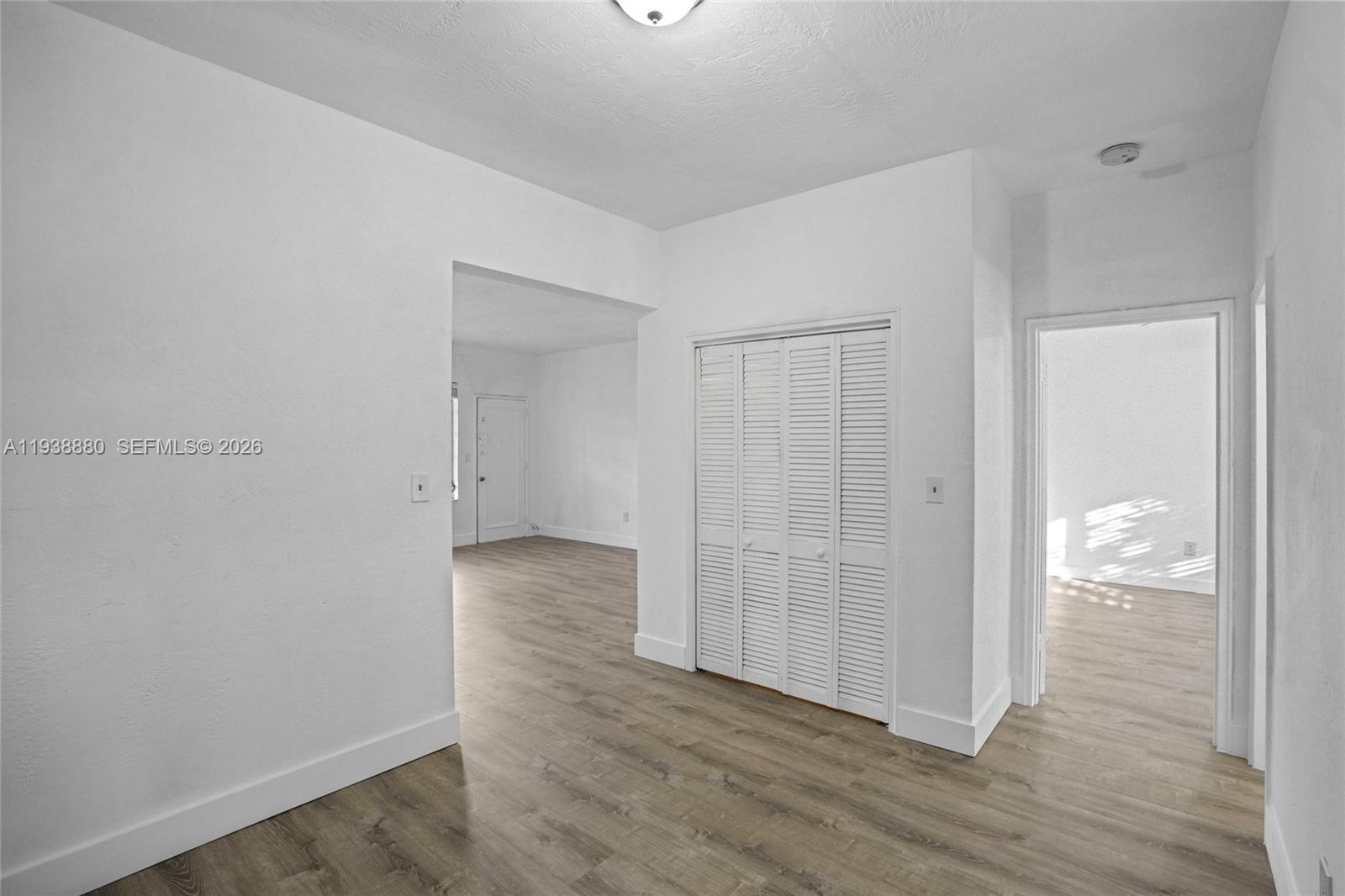 4172 Chase Avenue, Unit 3 Miami Beach, FL 33140 - Photo 9 of 29 wooden floor with white walls