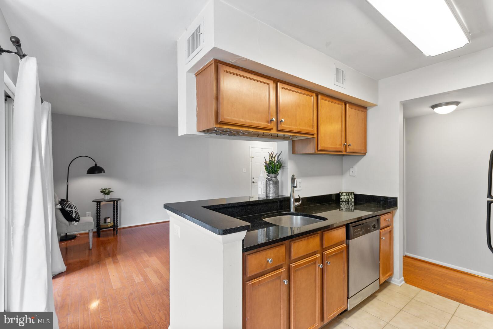 1705 Ascot Way, Unit B Reston, VA 20190 - Photo 10 of 24 Kitchen with Open View to Living Room