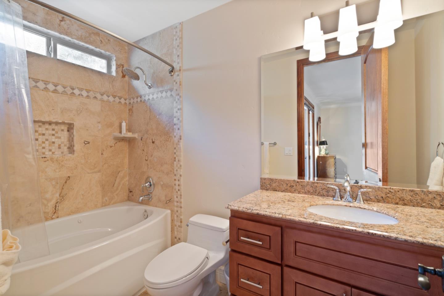 15525 Vía Eduardo Morgan Hill, CA 95037 - Photo 19 of 25 a bathroom with a granite countertop sink toilet and shower