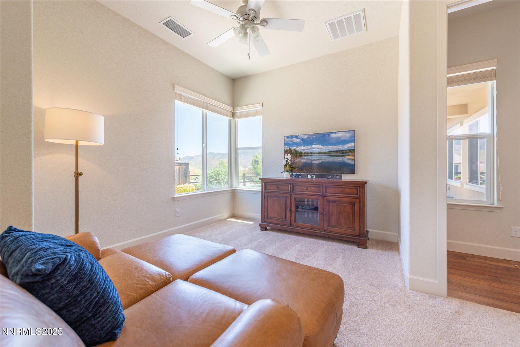 1197 Callaway Trail Reno, NV 89523 - Photo 17 of 38 a living room with a bed furniture and a window