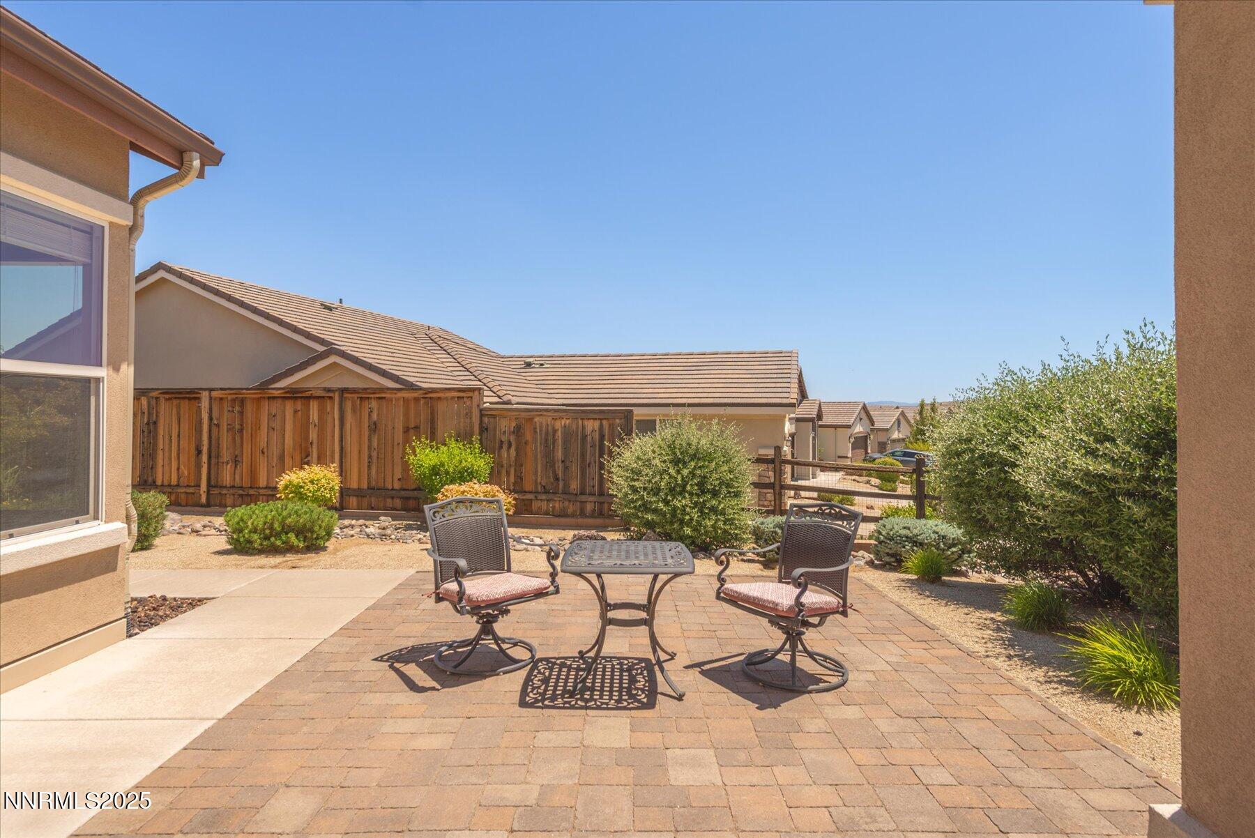 1197 Callaway Trail Reno, NV 89523 - Photo 3 of 38 a view of a patio with a table and chairs