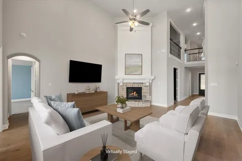 a living room with furniture fireplace and a flat screen tv